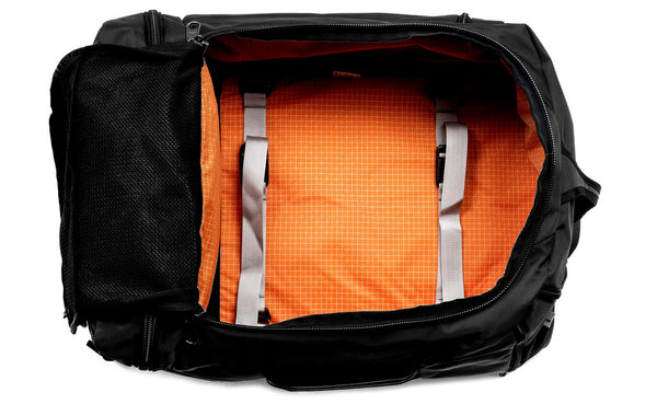 An open Techonaut 45 with a Black exterior and a Zest (orange) interior.